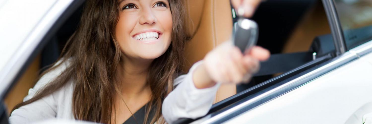Woman smile in car give key Woman smile in car give key