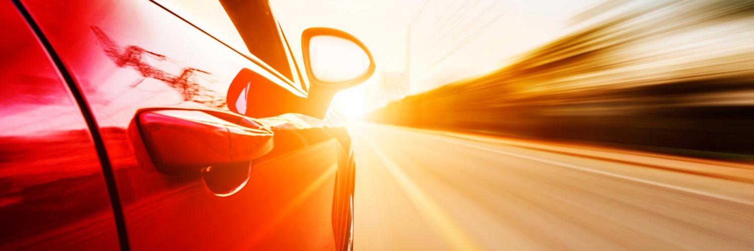 Image of red car in road