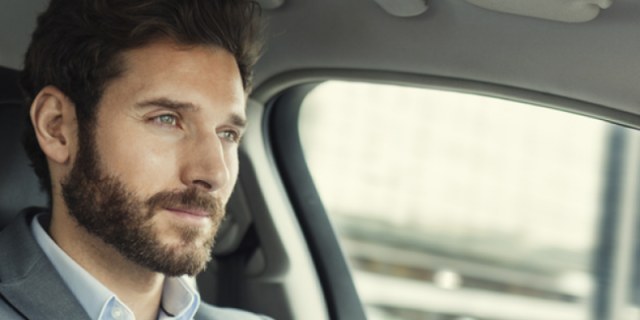 Man in a car driving 
