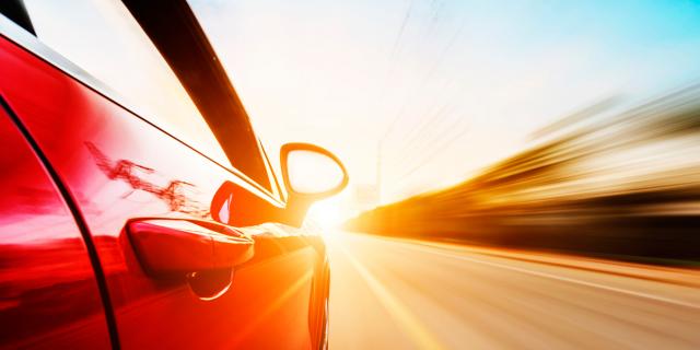Image of red car in road