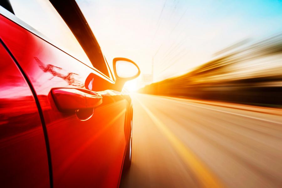 Image of red car in road