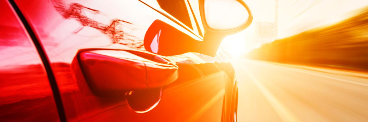 Image of red car in road